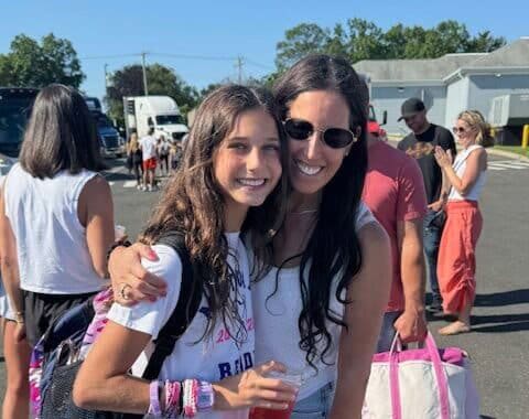 A smiling woman and girl enjoying a day at Ocean City, Maryland, with friends and family.