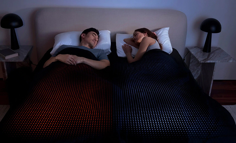Relaxing couple in bed at Ocean City, Maryland, enjoying a peaceful night.