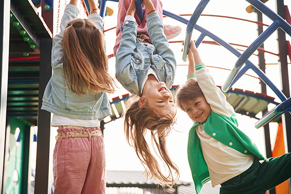 Resources in Our Community Kids playing on a playground.